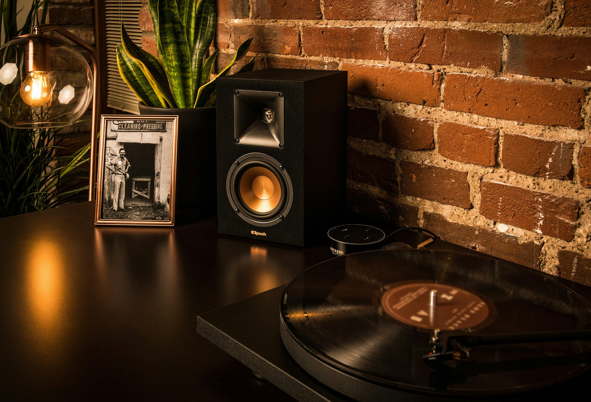 R-14PM powered speaker on a tabletop